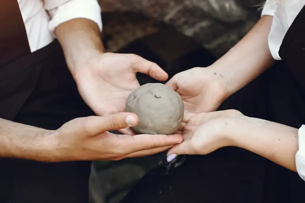 Hands holding an object with emotion