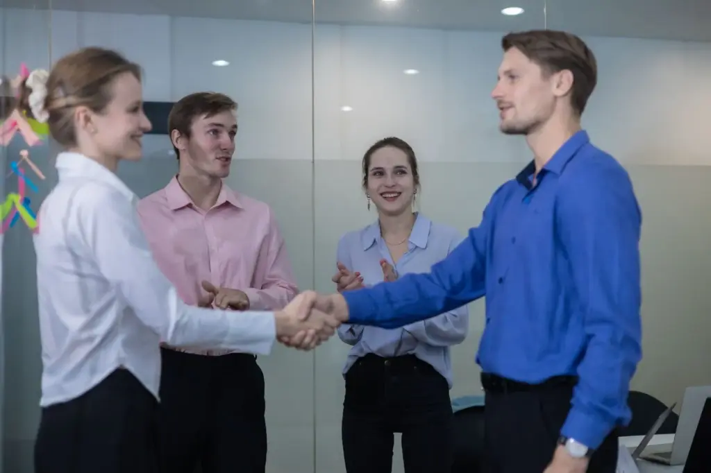 Handshake with the team