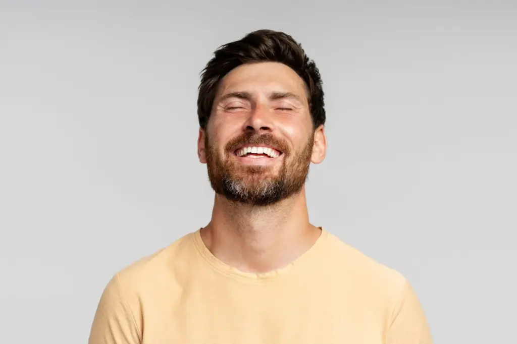 Head tilted and relaxed smile