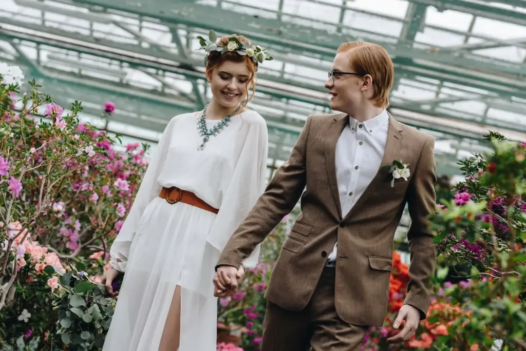 Holding hands inside a greenhouse