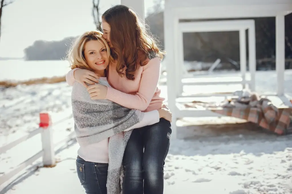 Hugging oneself in the cold for a cozy, candid moment