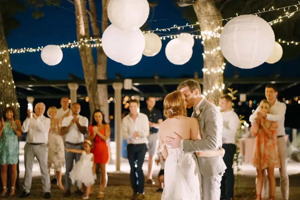Kiss under a canopy of floating lanterns