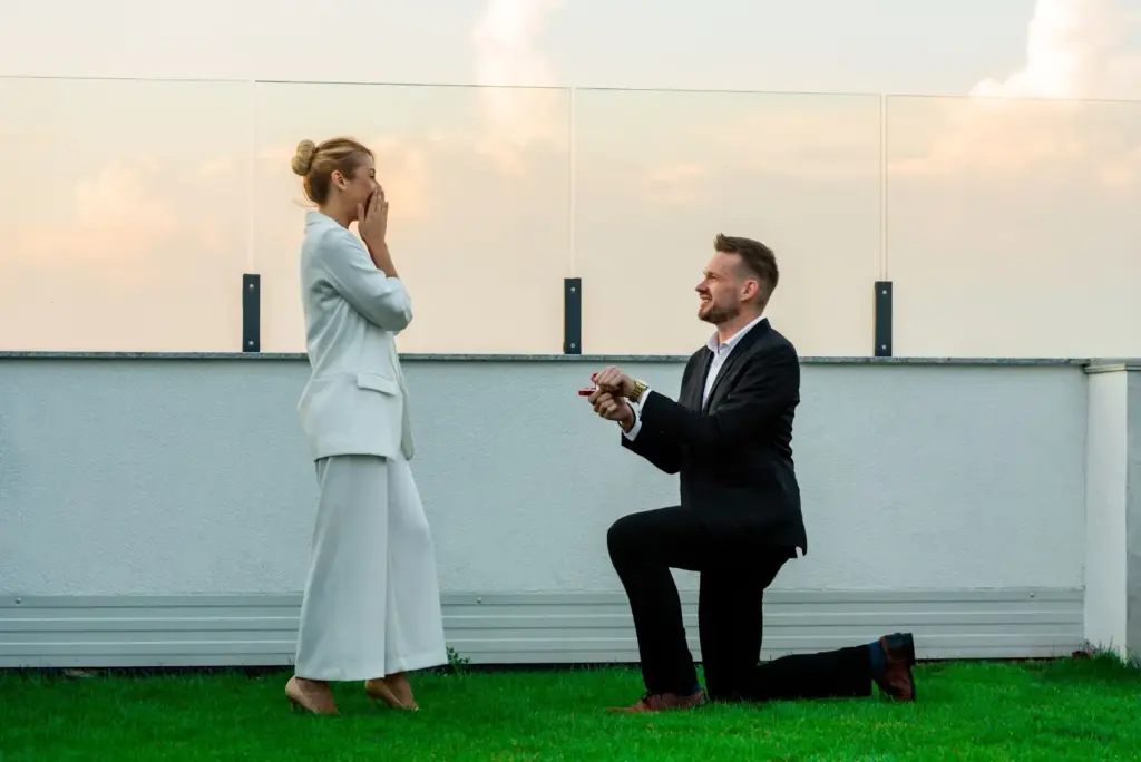Kneeling proposal with dramatic lights
