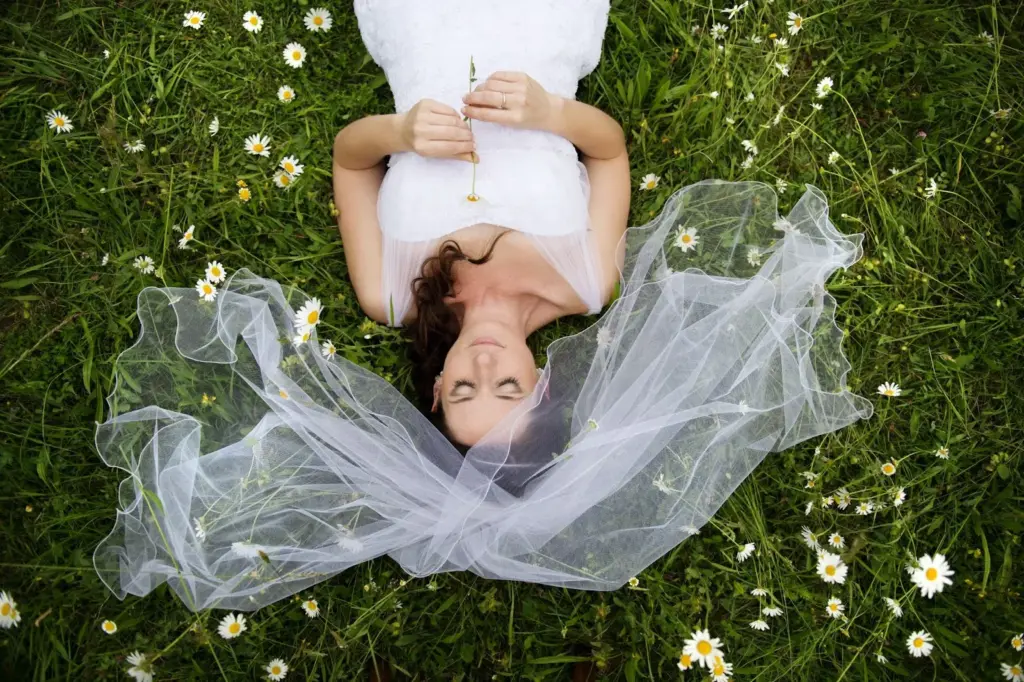 Laughing while lying in a flower field