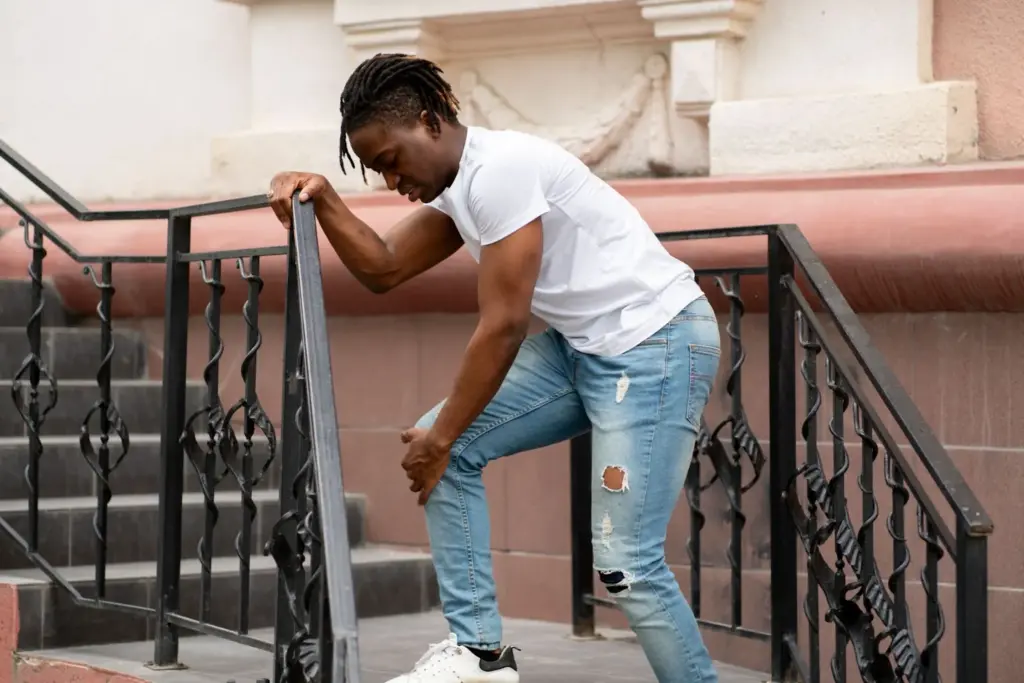 Leaning against a staircase