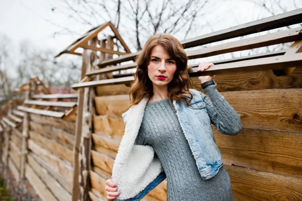 Leaning against a wooden wall or railing