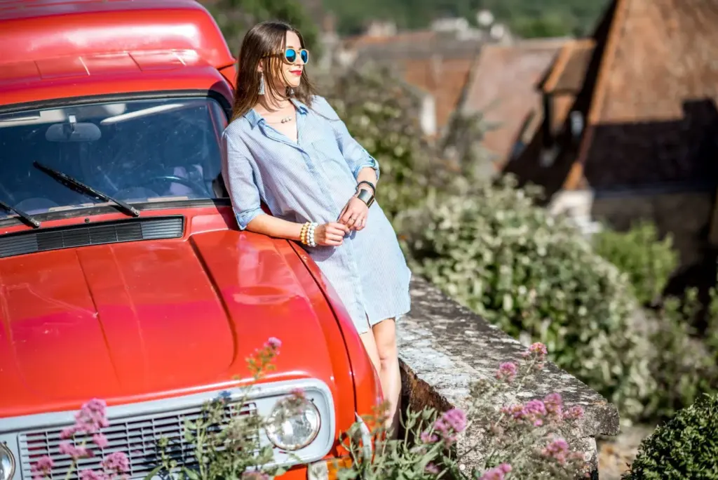 Leaning on a classic car or object