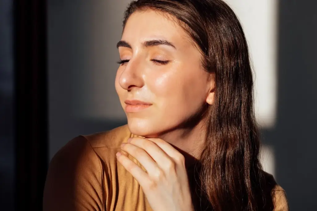 Light touch of hand on chin