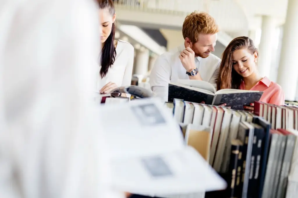 Looking at each other through the library aisle