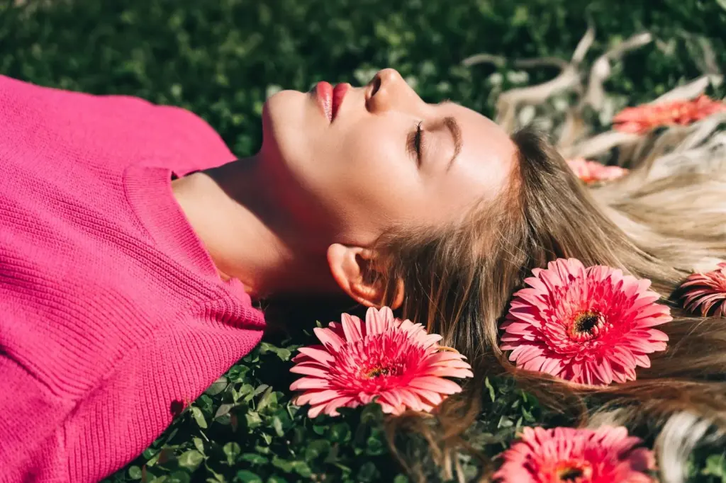 Lying on the ground with flowers in her hair