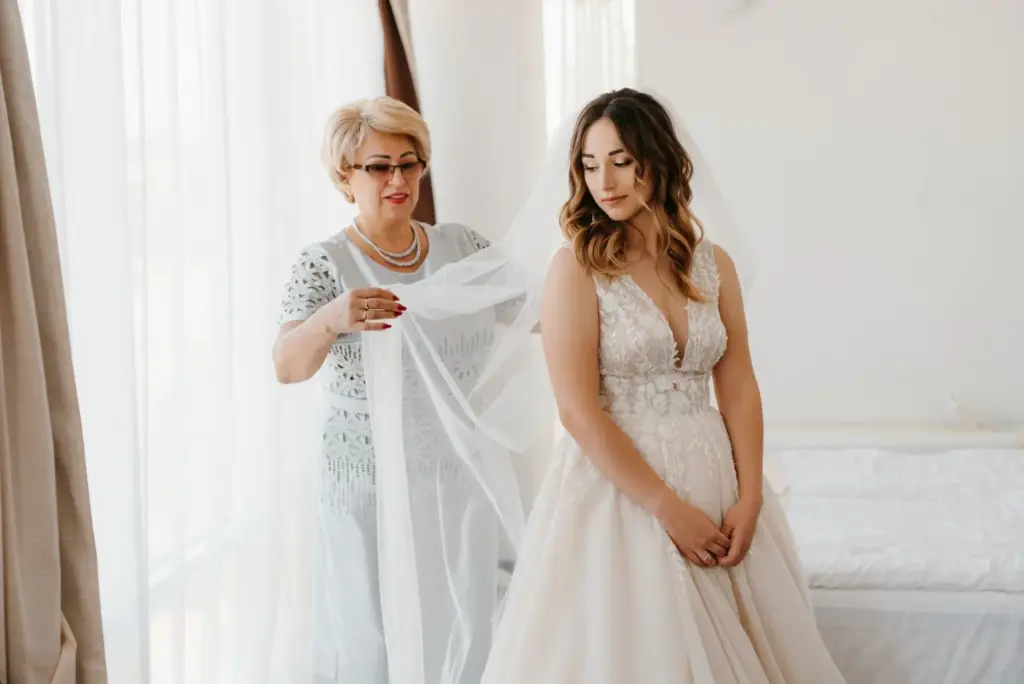Mother adjusting or fluffing the veil