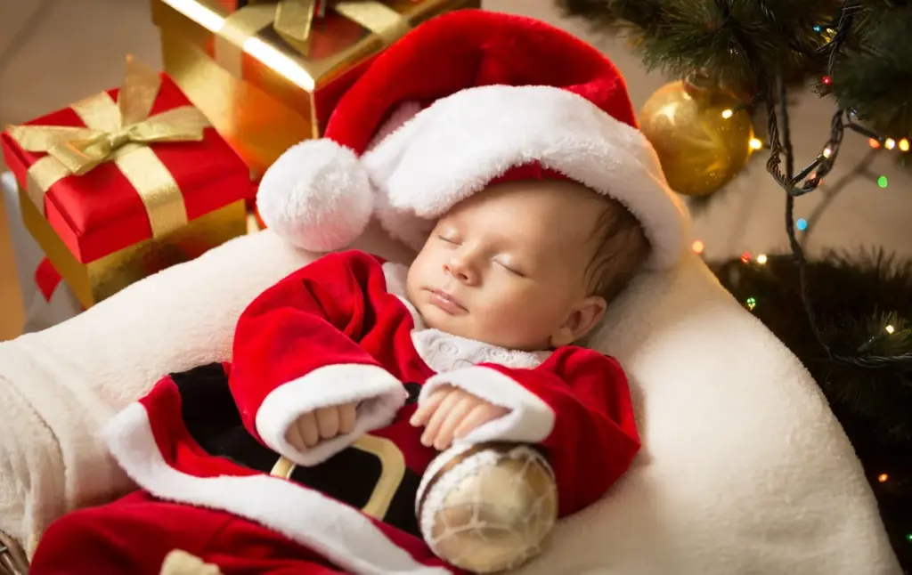 Newborn wearing a Christmas night suit