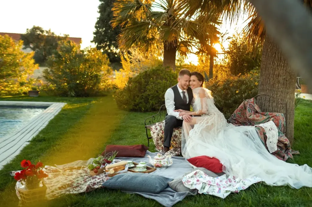 Picnic by a lake under a blooming tree