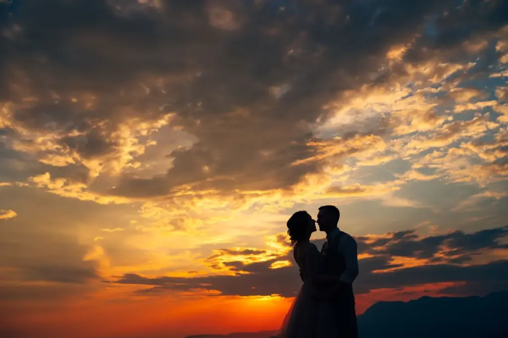 Romantic embrace framed by colorful sky