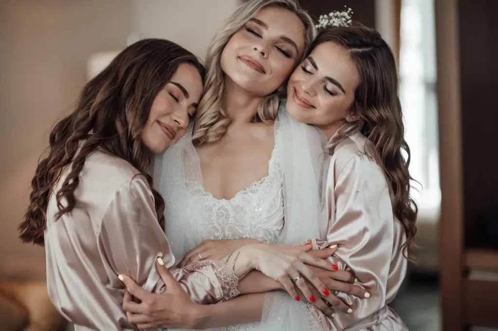 Sharing a group hug in matching robes