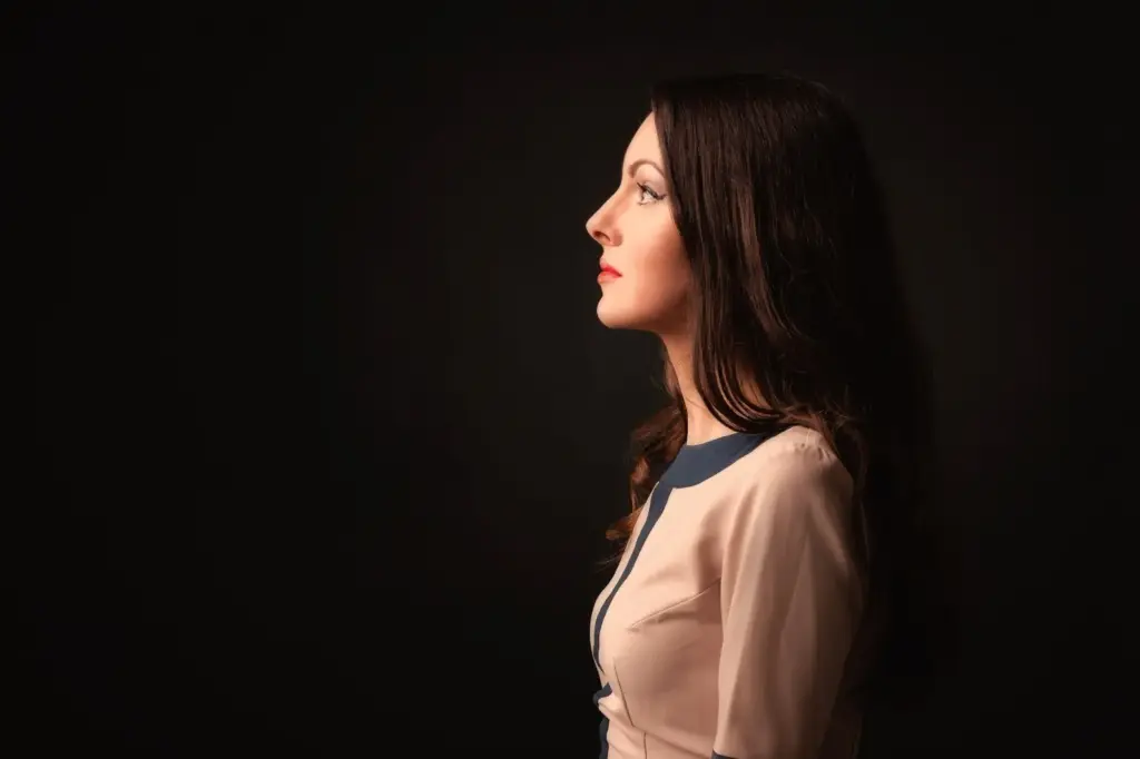 Side profile partly illuminated with light