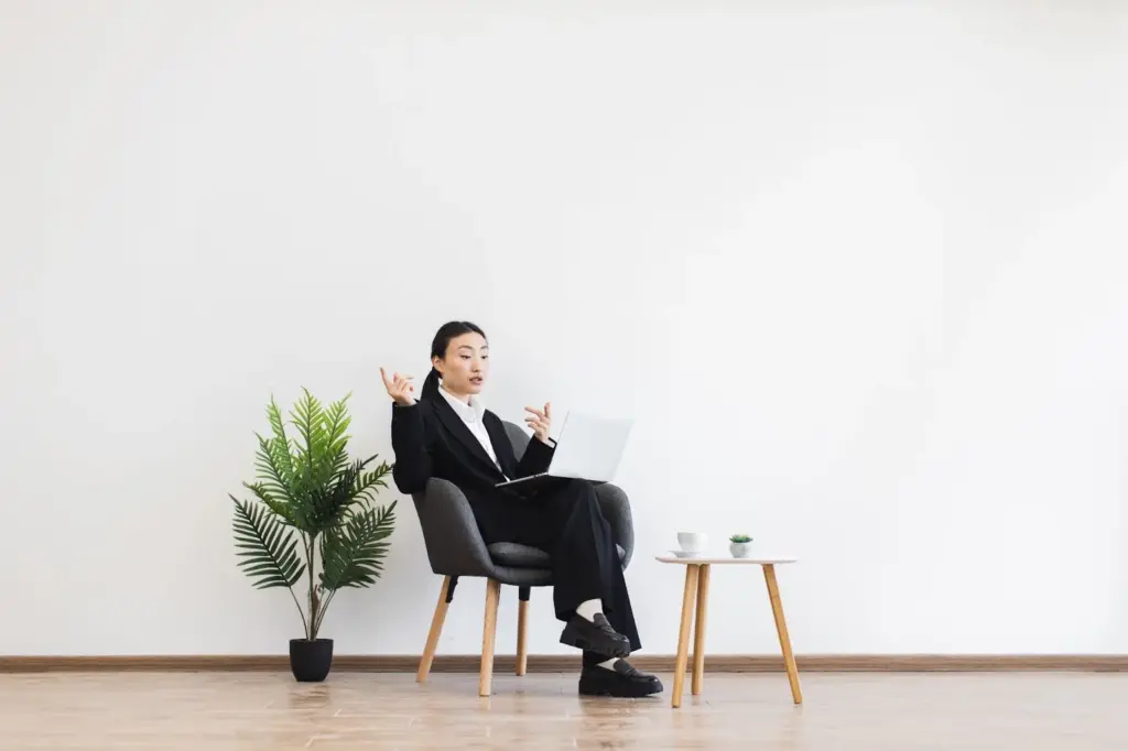 Sitting confidently with professional props in the background