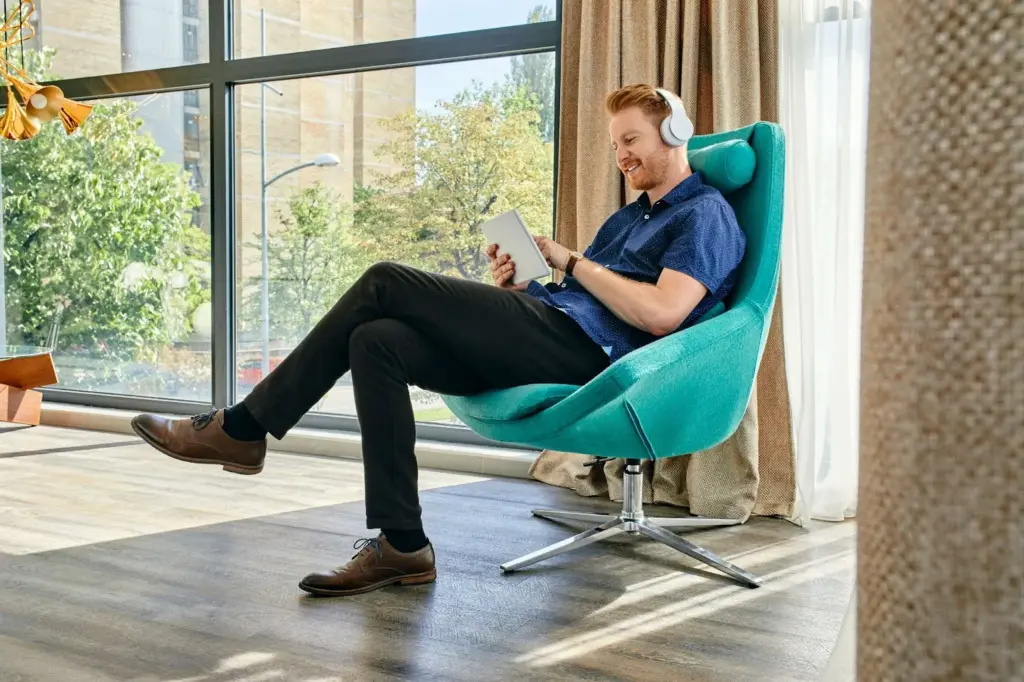 Sitting in a modern chair with a relaxed posture