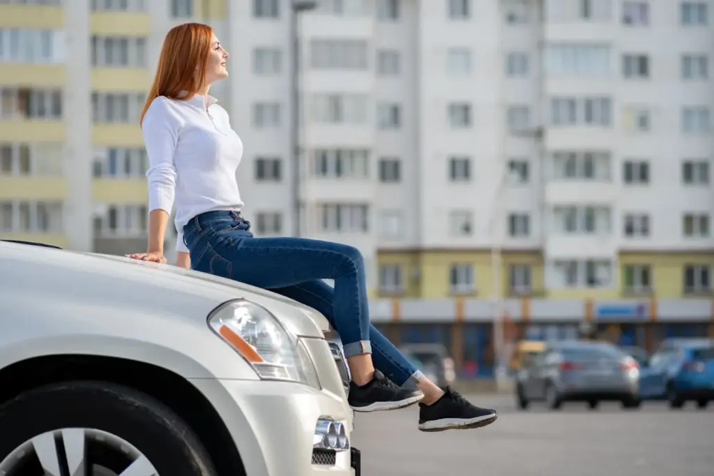 Sitting on a parking bumper