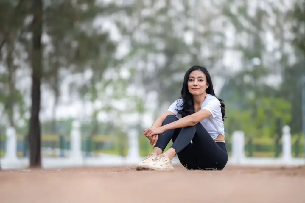 Sitting on dry ground and smiling