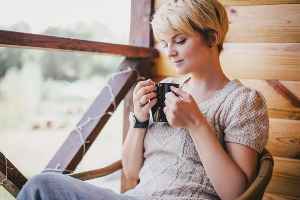 Sitting on the porch and drinking hot coffee