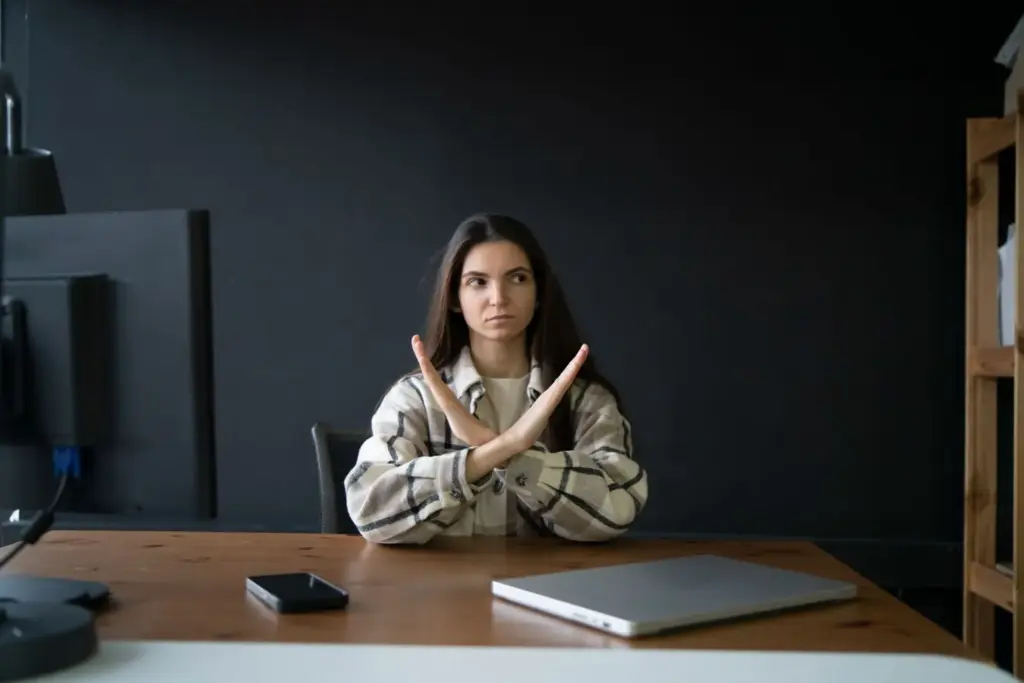 Sitting straight with crossed hands