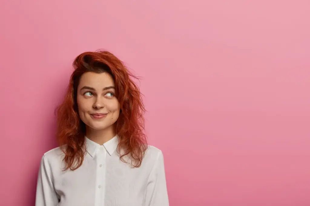 Slight smirk with bold backdrop