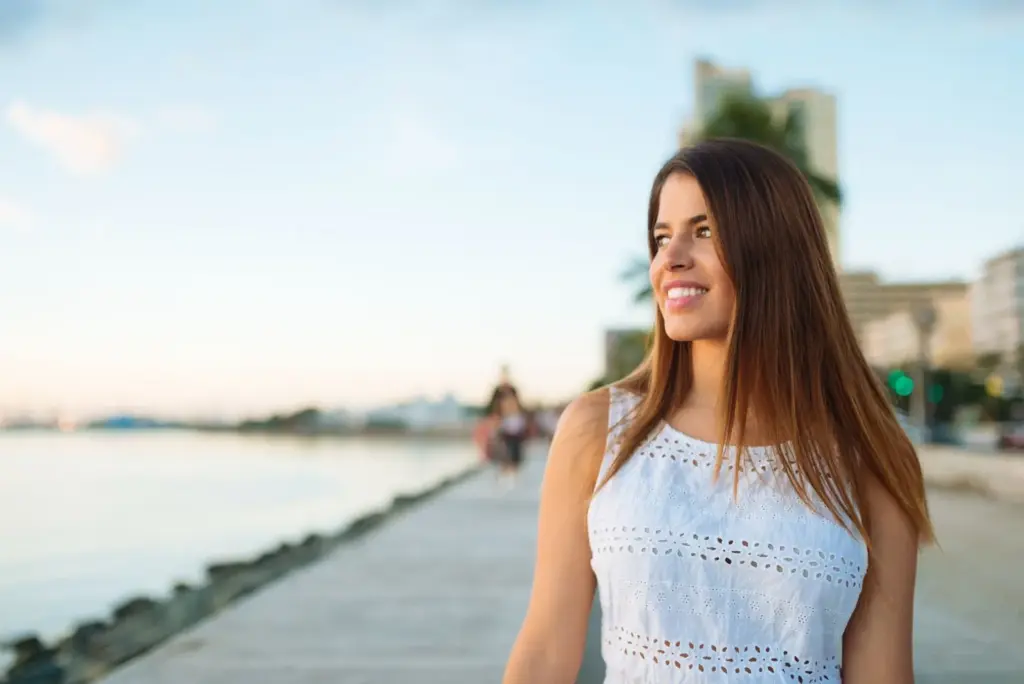 Smiling and walking on the shore