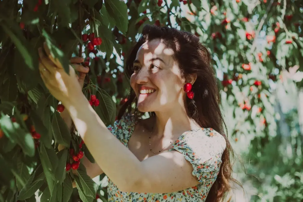 Smiling while picking fruit
