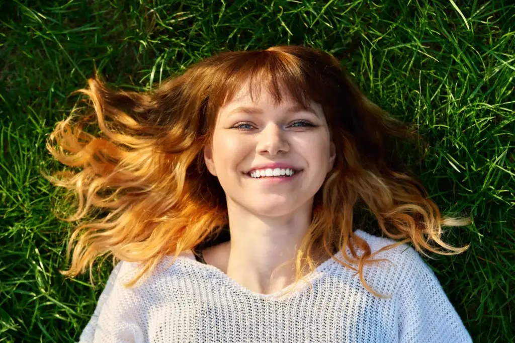 Smiling with grass in the Foreground