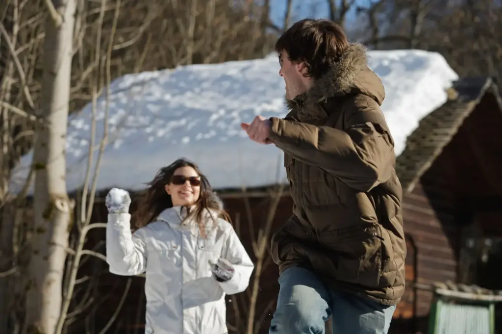 Snowball fight in an alpine landscape