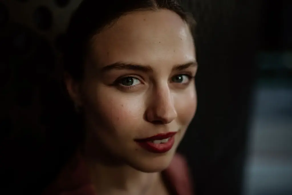 Soft smile with deep shadows on the face