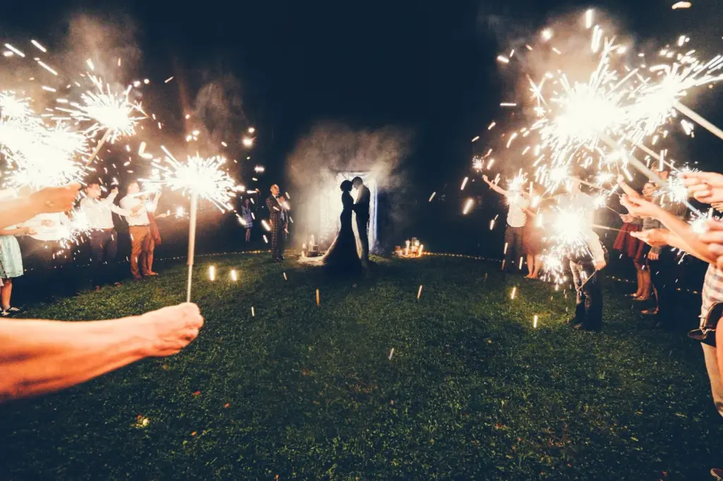 Sparkler exits as fireflies flicker in the warm air