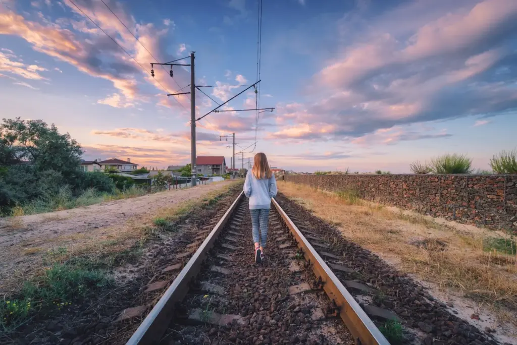 Standing with tracks disappearing behind