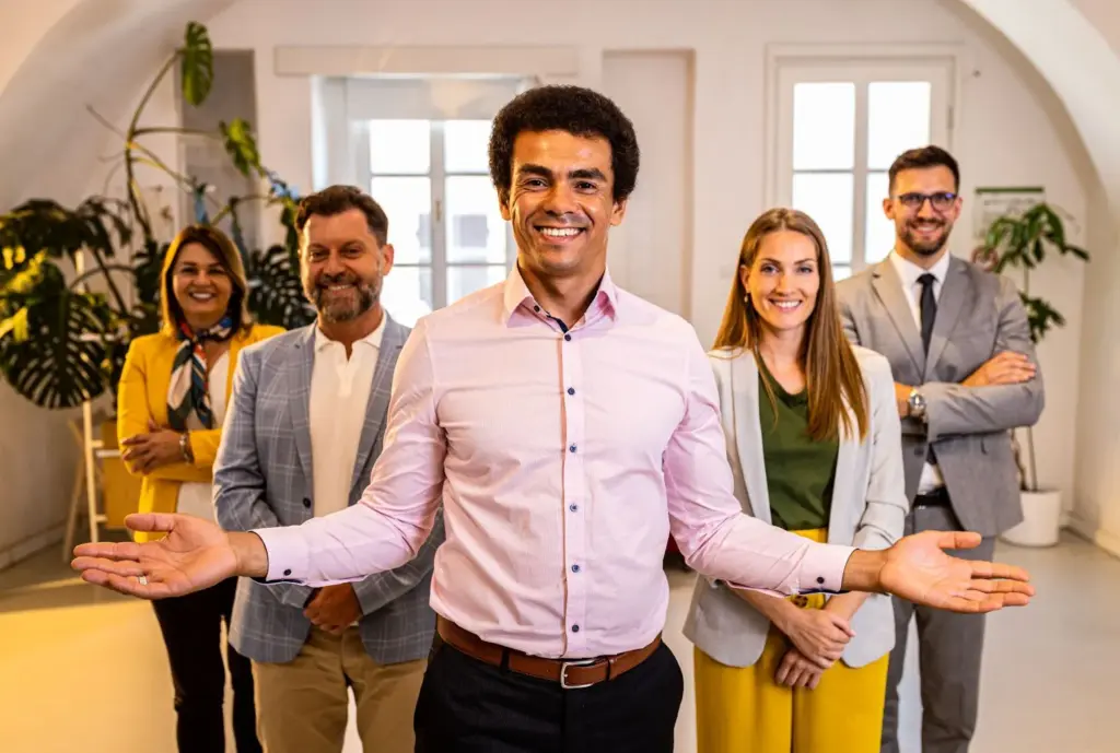 Straight face to the camera with workplace logo in the background