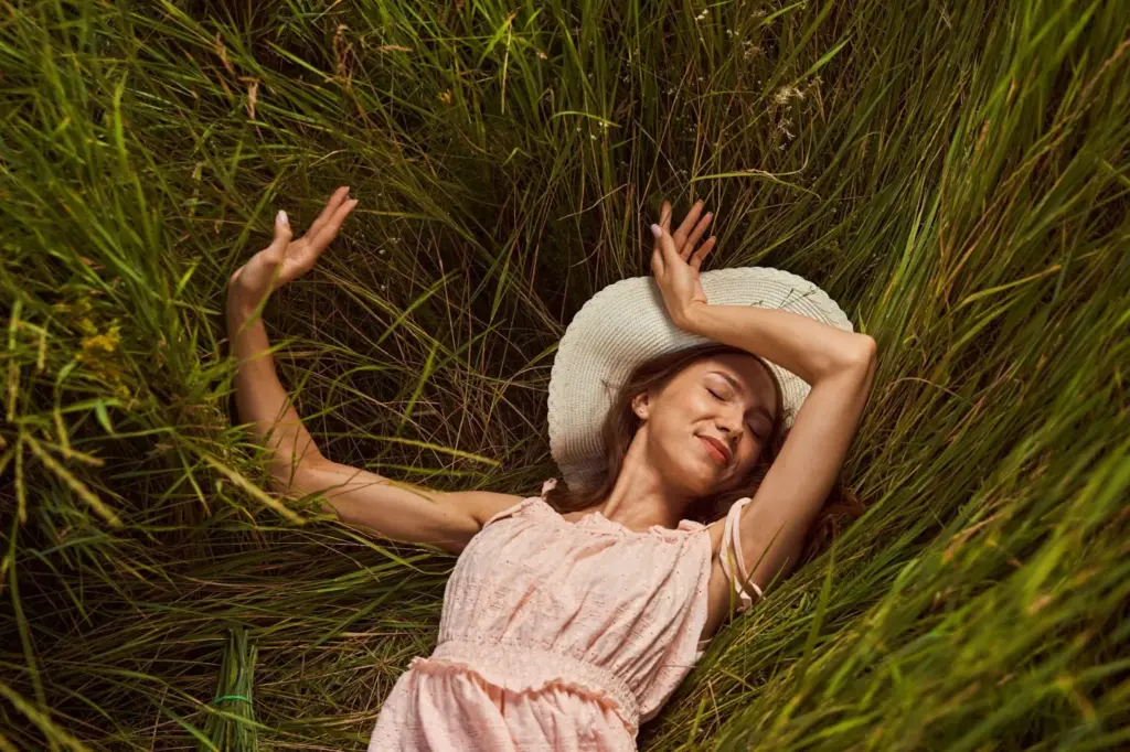 Surrounded by grass with closed eyes