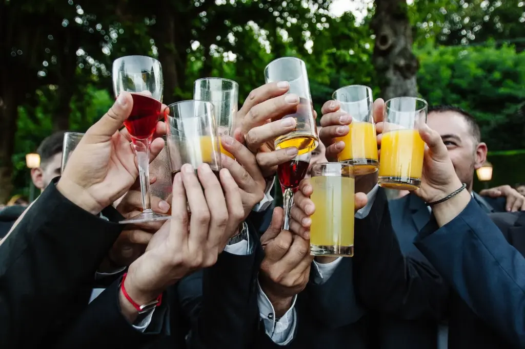 Toasting glasses of juice