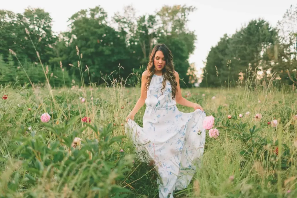 Twirling in a flowy dress among flowers