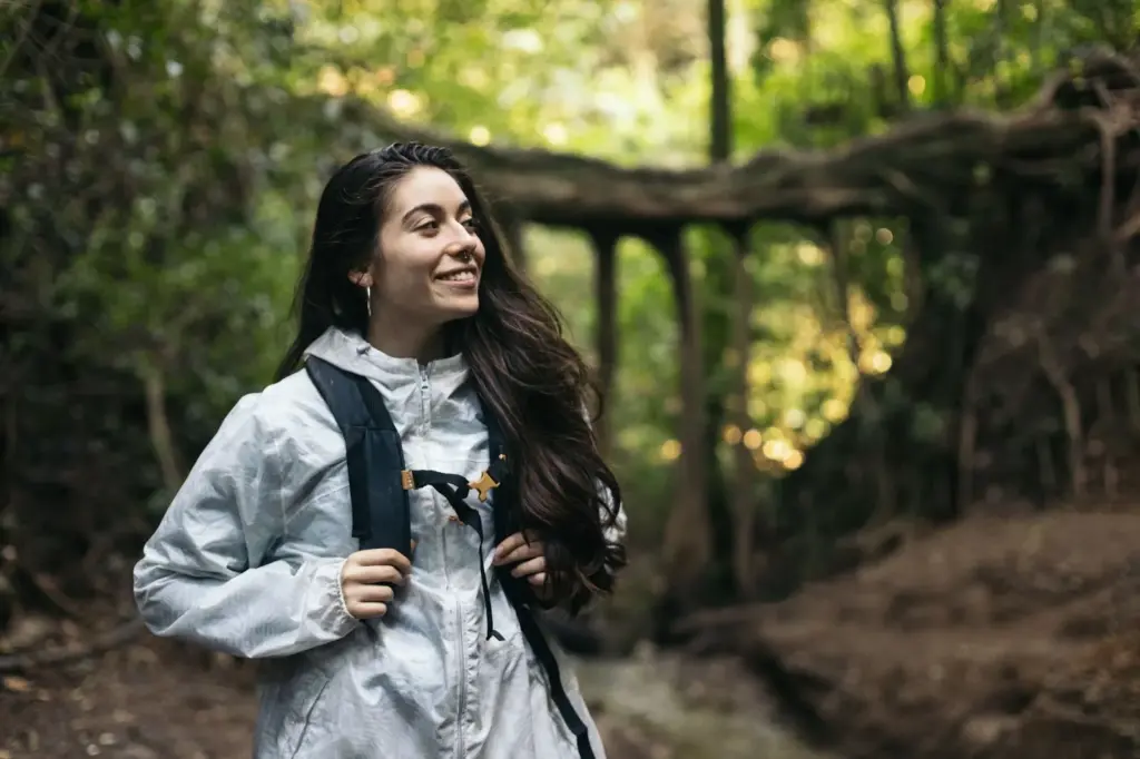 Walking and smiling on a forest trail