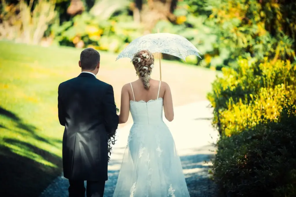 Walking hand-in-hand in drizzle