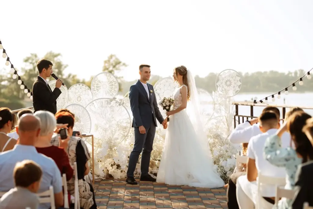 Wide ceremony shot with guests in the backdrop