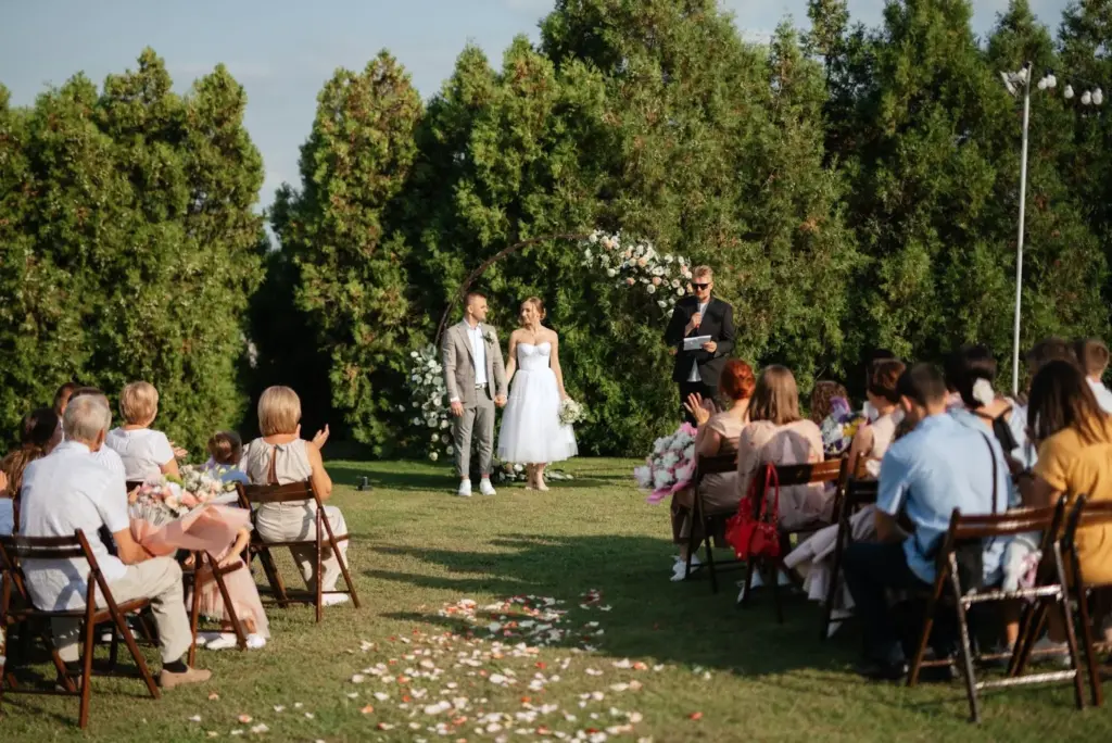 Wide shot of the ceremony in the blooms