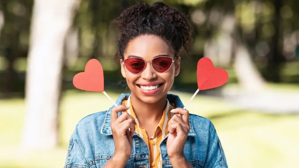 With colourful sunglasses and hearts as props