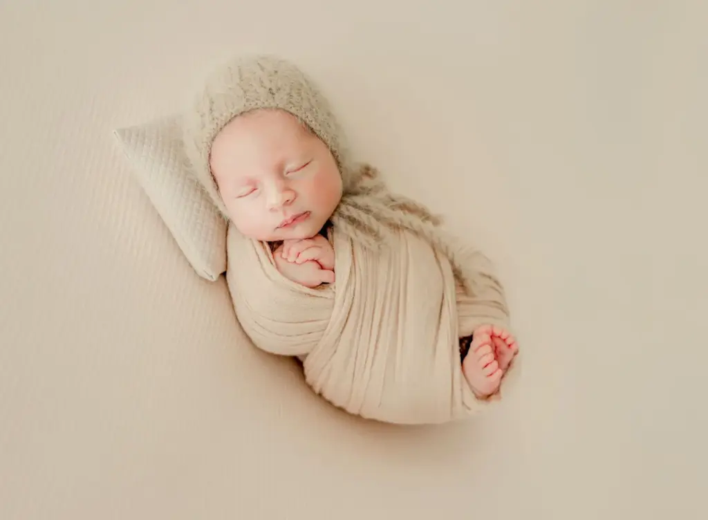 Wrapped in a blanket with a head tilt