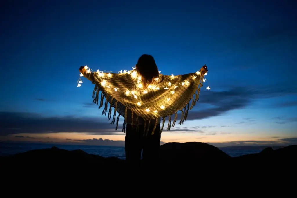 Wrapped in a shawl, watching the stars