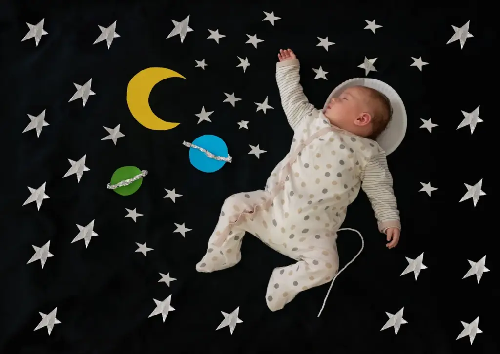 Your little astronaut in a dreamy outer space setup