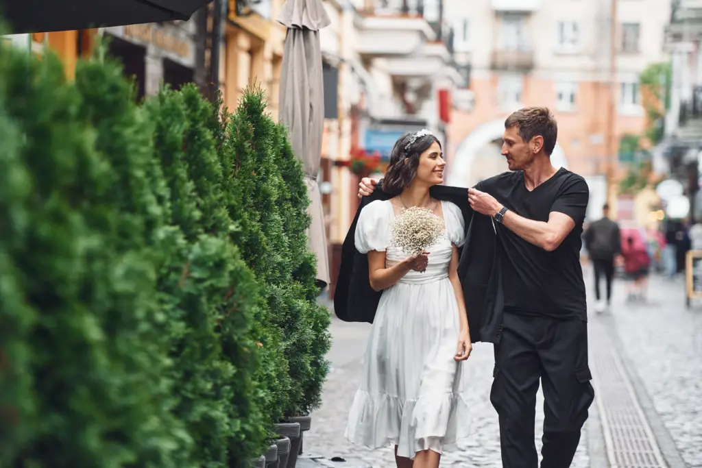 20+ Creative Group Wedding Photo Ideas for Family and Friends 21 Beautiful bride with his fiancé is celebrating wedding outdoors.