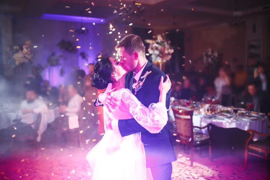 20+ Creative Group Wedding Photo Ideas for Family and Friends 77 A Magical First Dance Filled with Confetti and Love