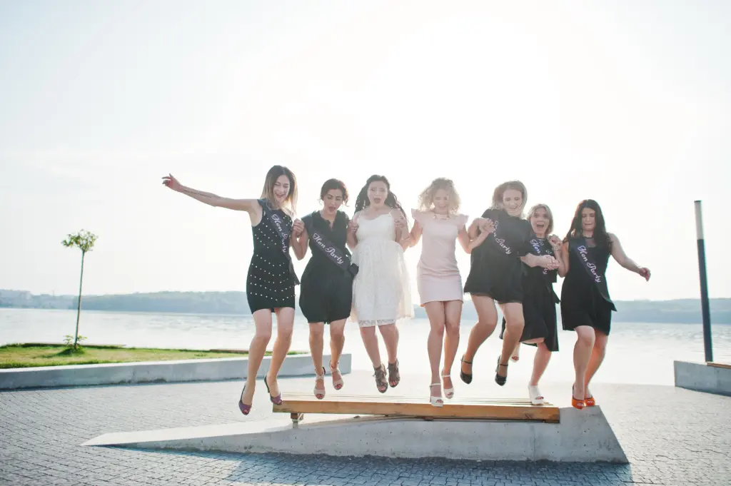 20+ Creative Group Wedding Photo Ideas for Family and Friends 73 Energetic Hen Party Fun with the Bride and Her Girls Jumping Together