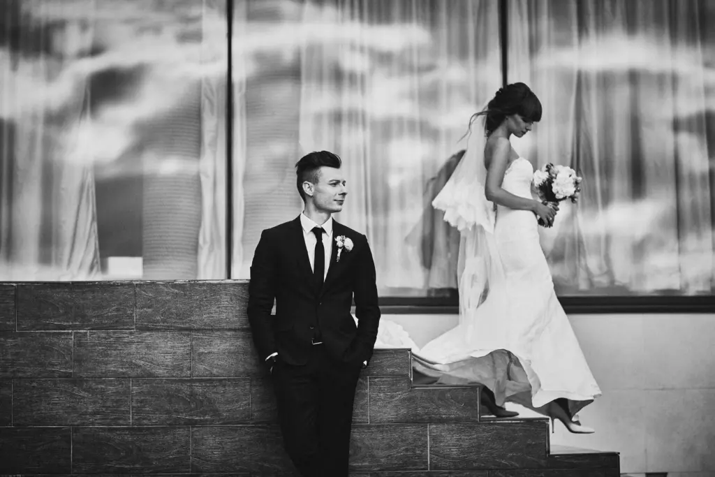 20+ Creative Group Wedding Photo Ideas for Family and Friends 98 Intimate Black & White Wedding Moment Filled with Quiet Elegance